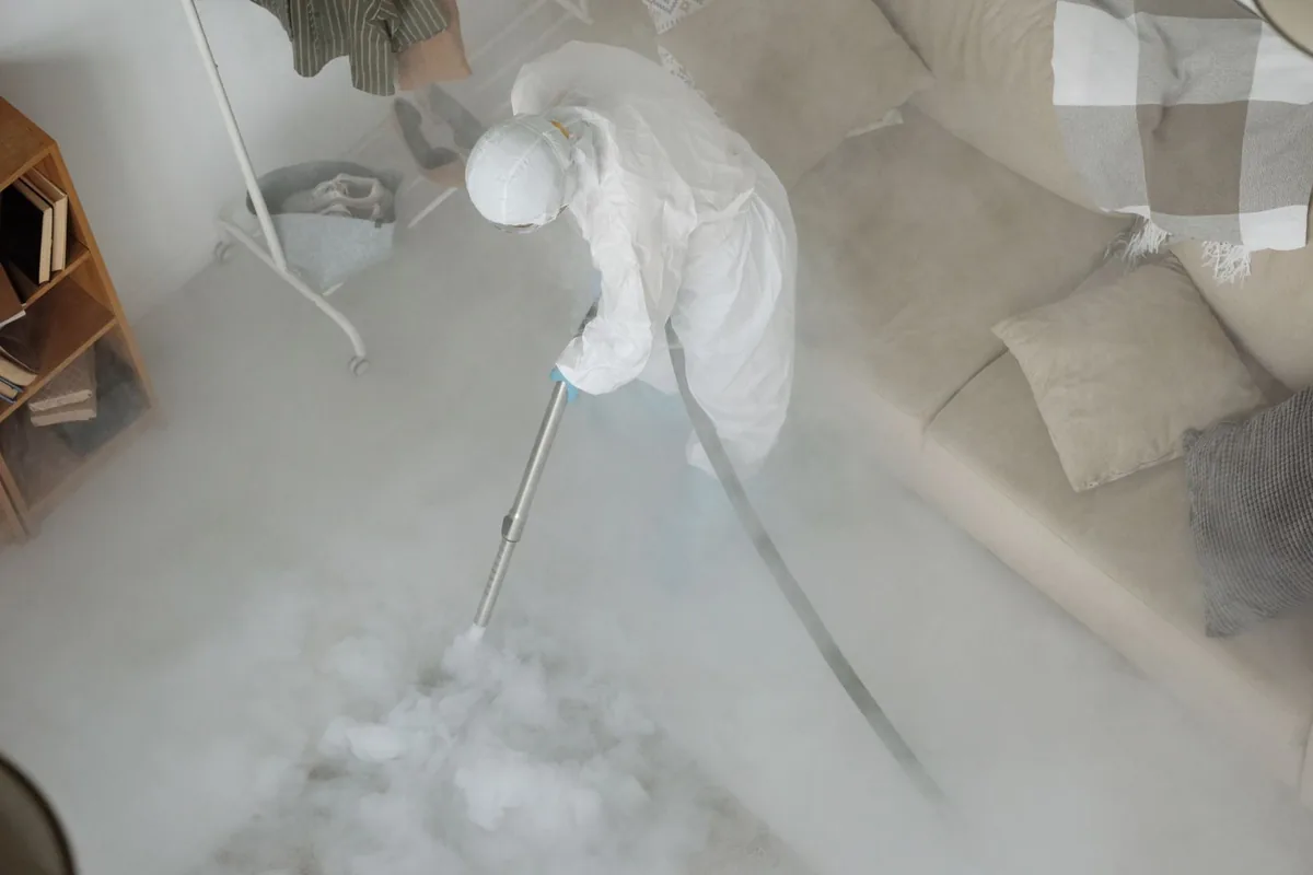 Biohazard cleanup technician in protective equipment, Vollintine-Evergreen, Memphis, TN